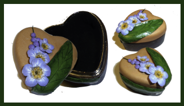 Hand sculptured lttle leather box with hand sculptured For-Get-Me-Not flowers and leave